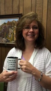 Shannon with her writing coffee cup